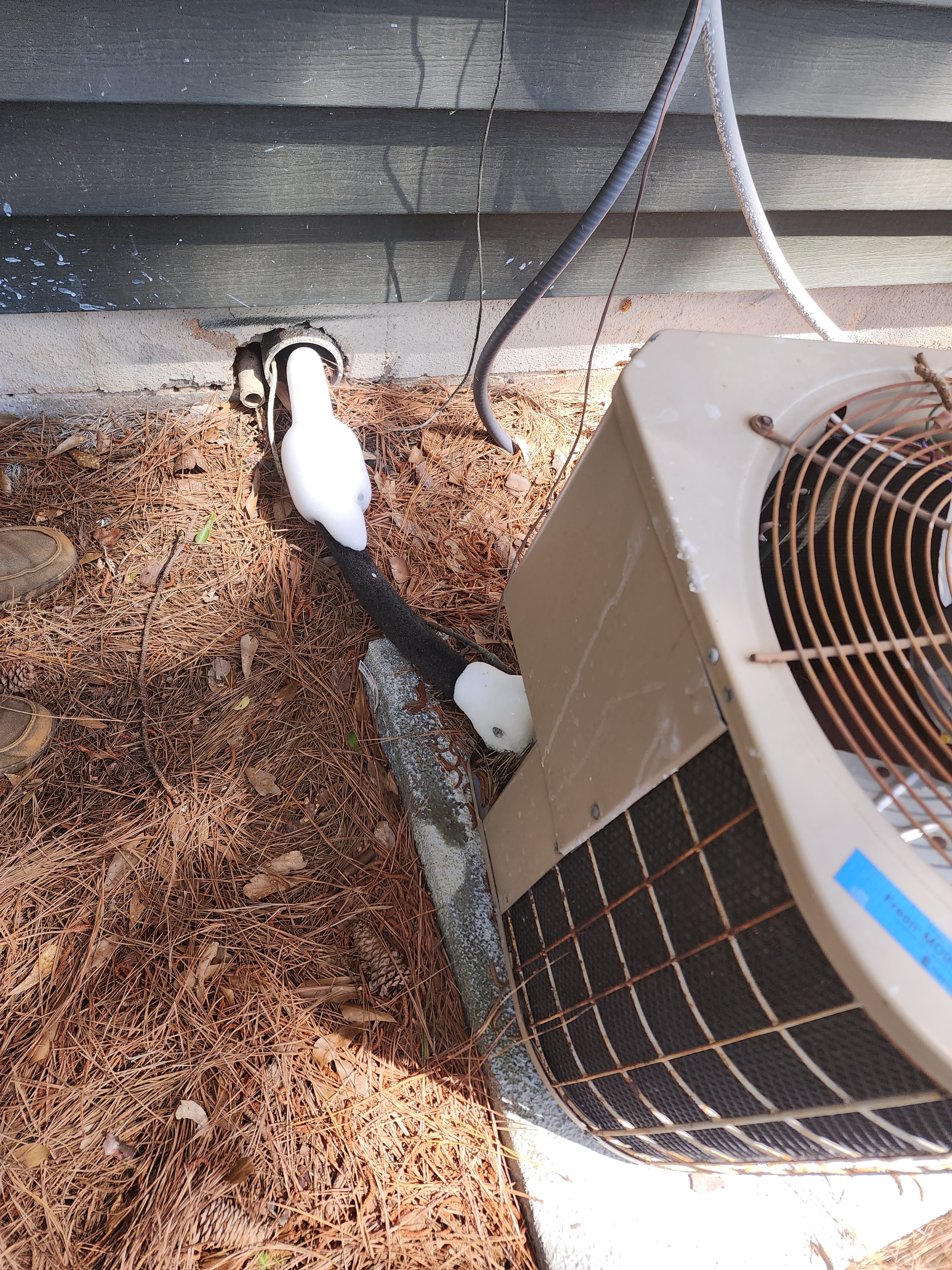 Rusted condenser coil fins before AC replacement — Garris Air