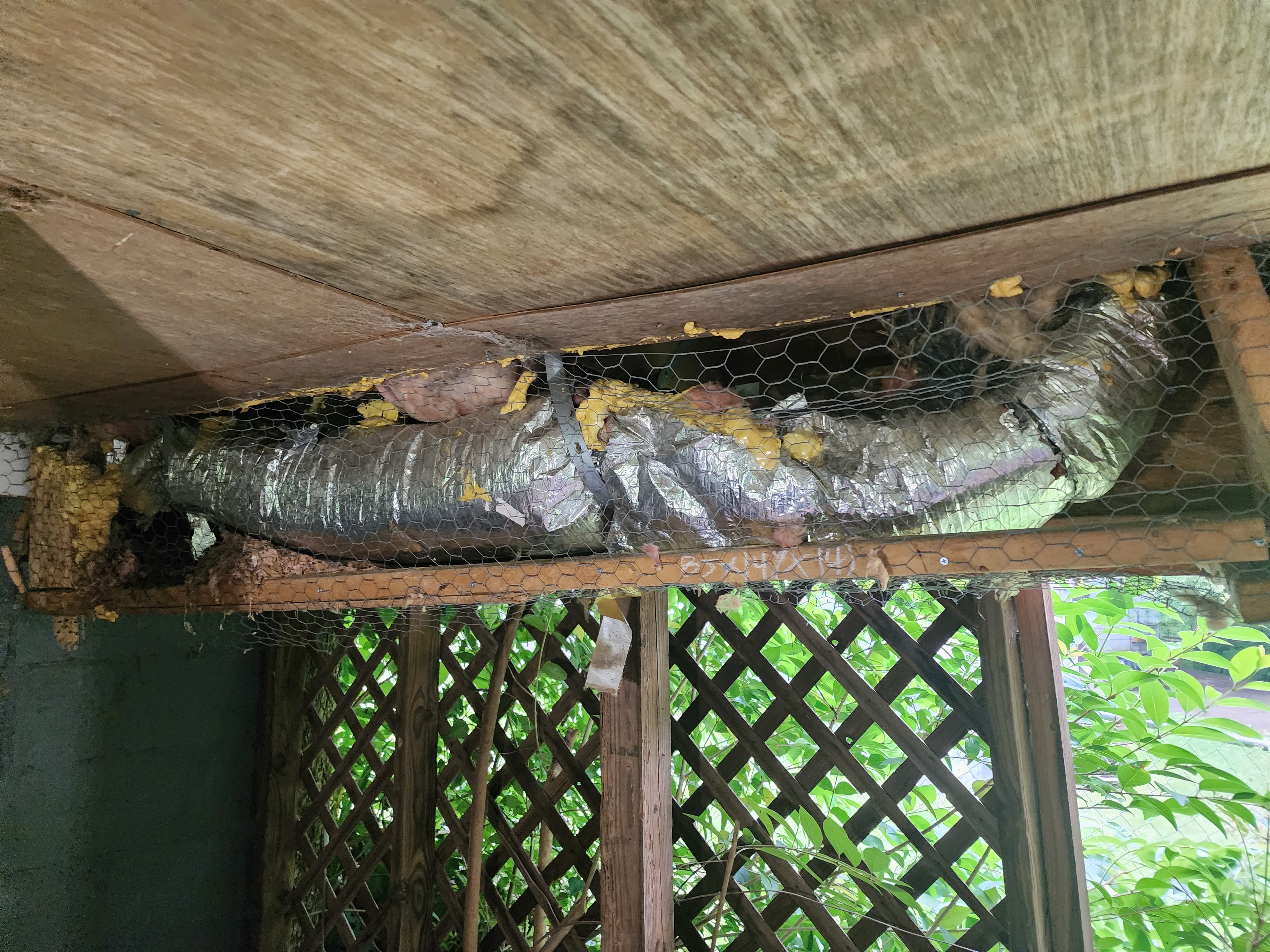 Damaged ductwork on porch before replacement — Garris Air